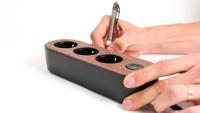 mynolla-power-strip-black-walnut-hands.jpg